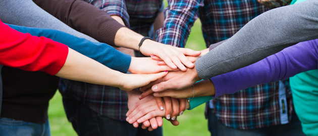 Multiracial Students with Hands on Stack